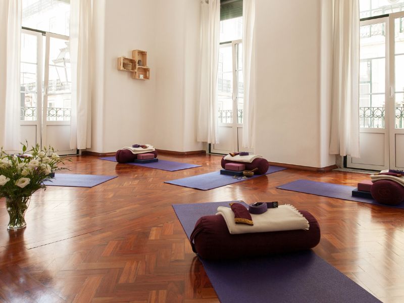 yoga studio with mats and bolsters set up